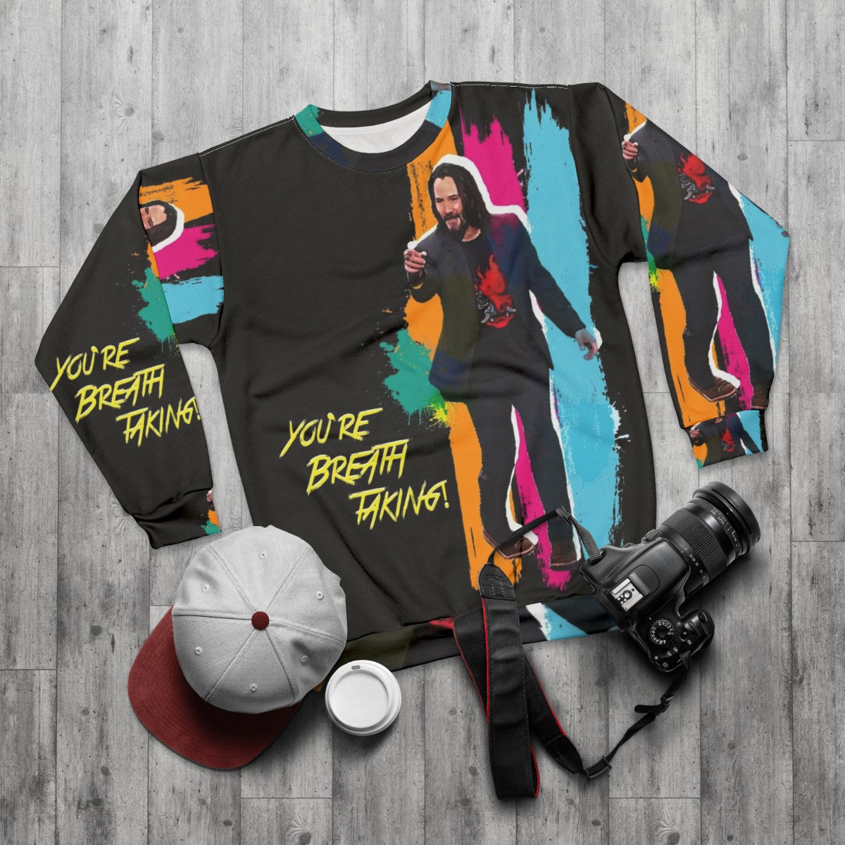 Keanu Reeves inspired "You're Breathtaking" cyberpunk sweatshirt in vivid rainbow colors - flat lay