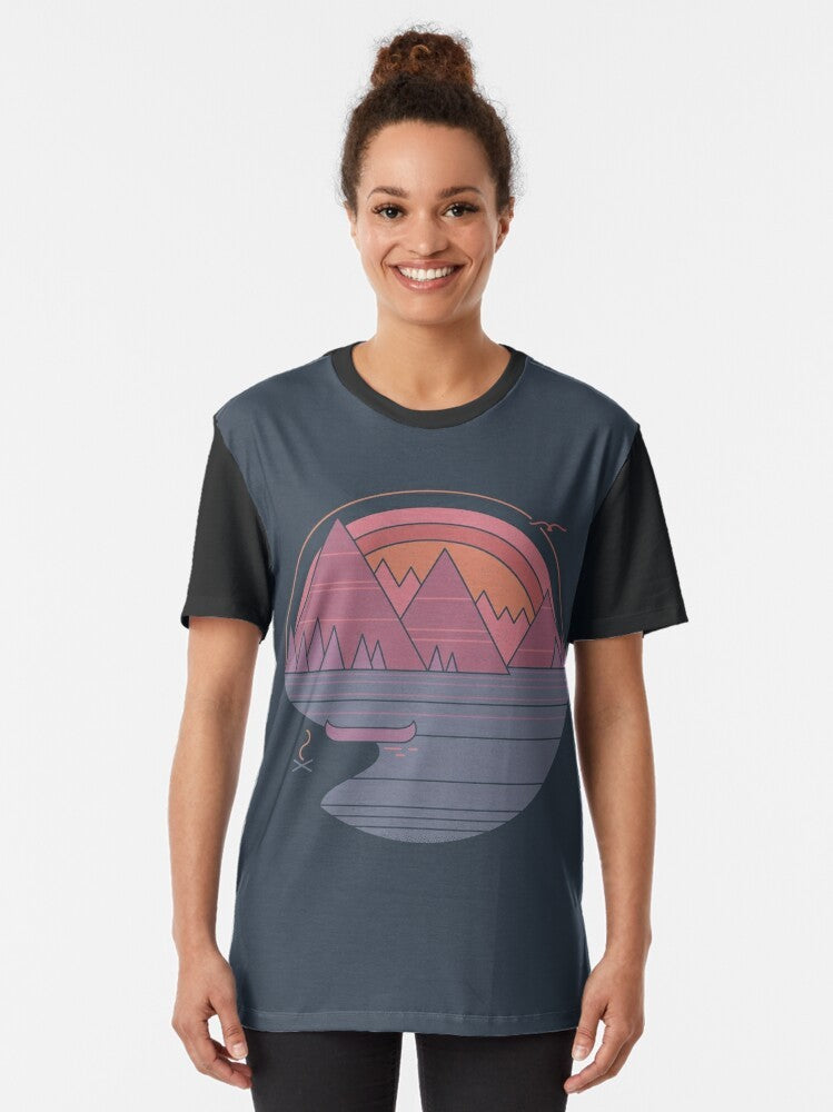 Graphic t-shirt with a minimalist mountain landscape design, perfect for outdoor enthusiasts and adventure-seekers. - Women