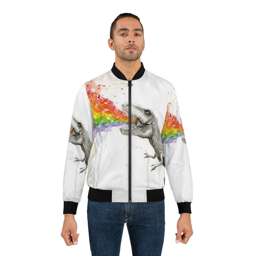 Whimsical t-rex dinosaur wearing a colorful rainbow watercolor bomber jacket - Lifestyle