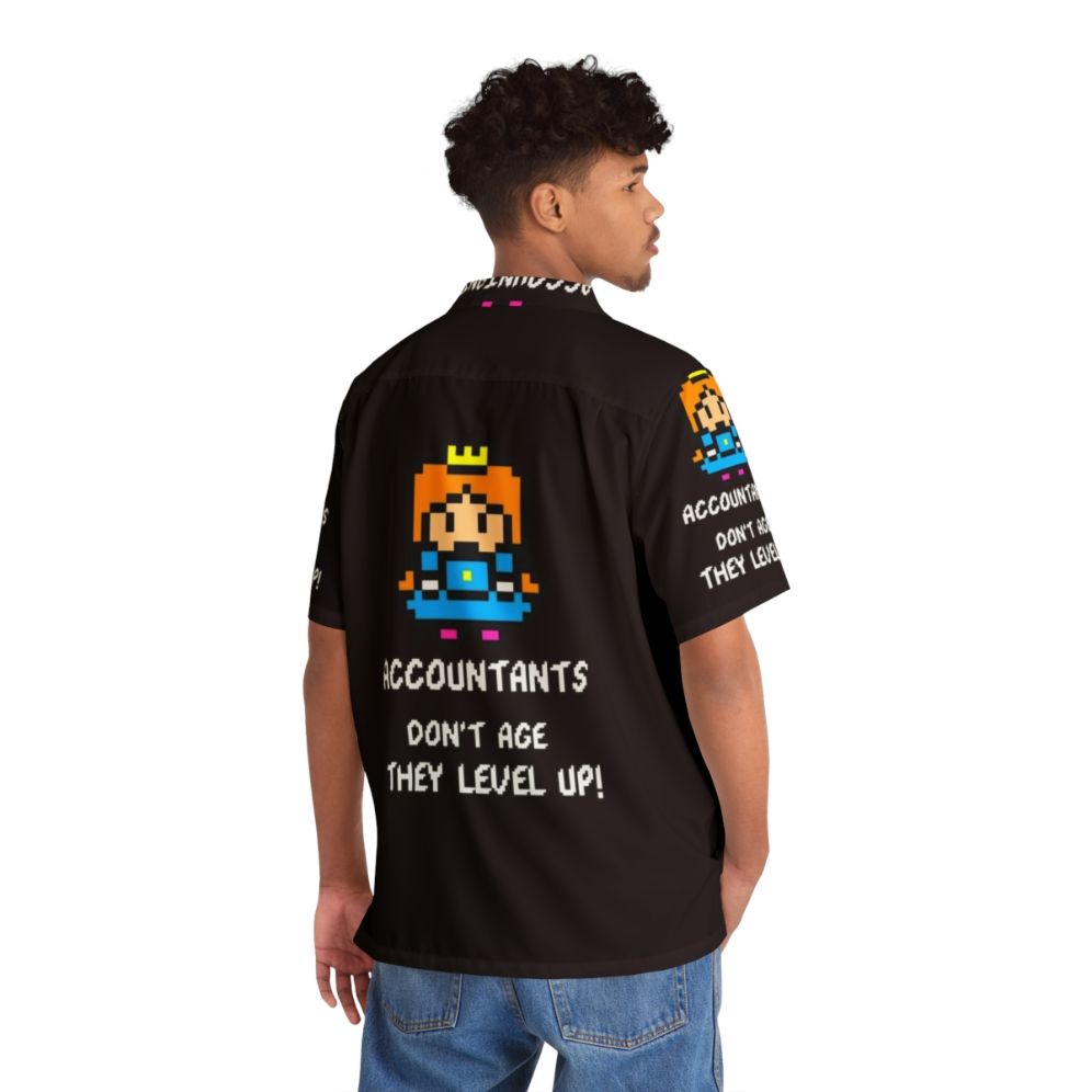 Accountant's Hawaiian shirt with 8-bit gaming and leveling up design - Flat lay