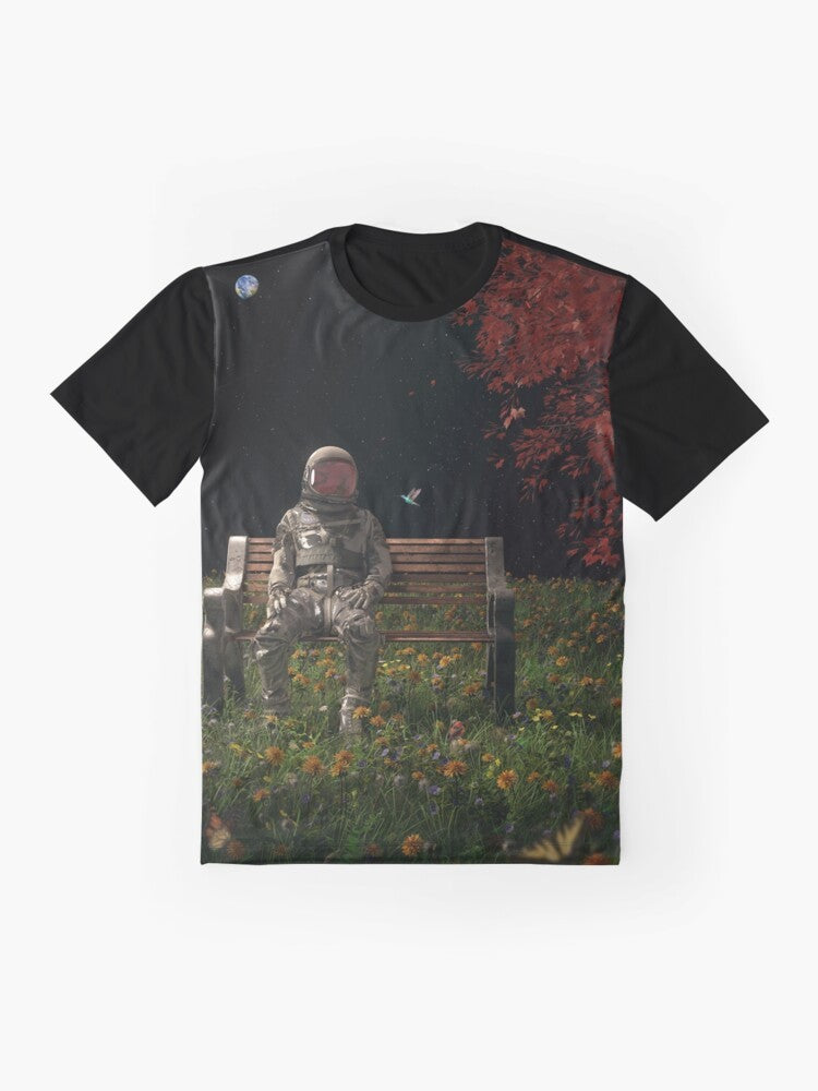 Surreal graphic t-shirt featuring an astronaut in a cosmic, nature-inspired landscape - Flat lay