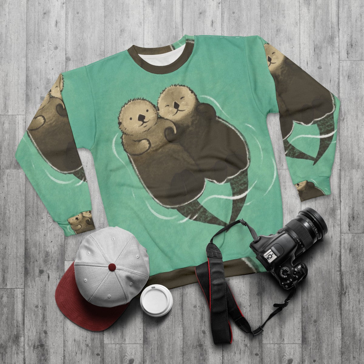 Significant otters holding hands printed on a cozy sweatshirt - flat lay