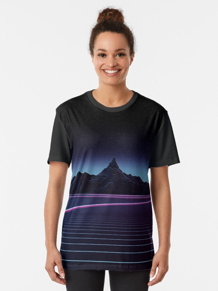 A retro-inspired t-shirt featuring a graphic design of a highway through a mountainous landscape, with a neon and gridline aesthetic reminiscent of 80s synthwave and vaporwave styles. - Women