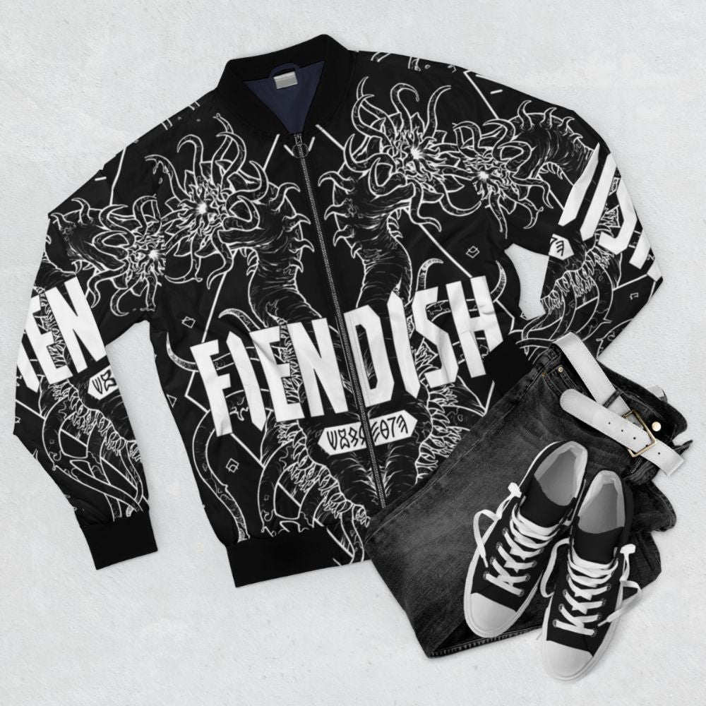 Fiendish bomber jacket with a dark and geometric inspired design, featuring monster and horror elements. - Flat lay