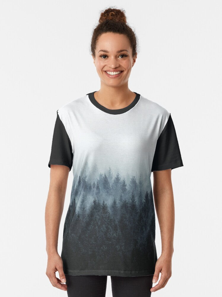 A nature landscape graphic t-shirt featuring trees, fog, and mountains for outdoor adventure and wanderlust - Women