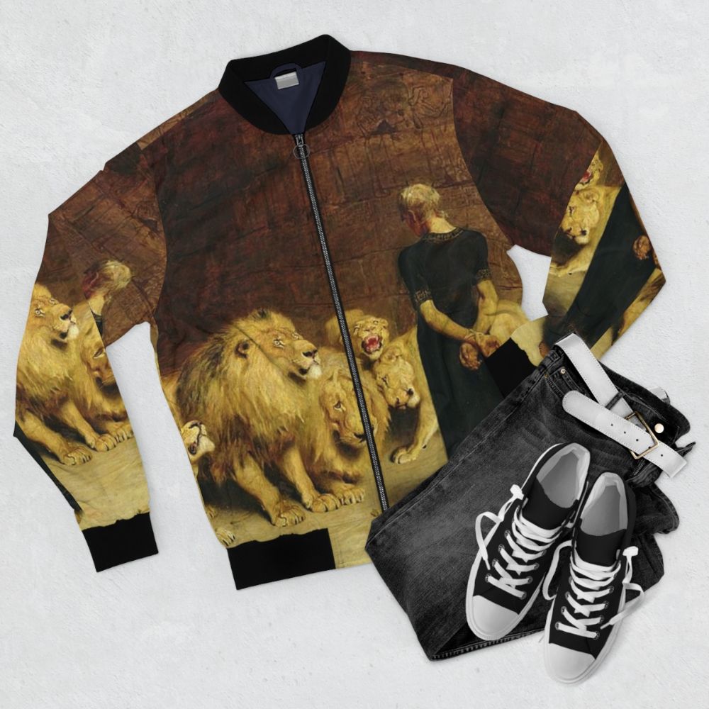 Vintage bomber jacket featuring a biblical scene of Daniel in the lions' den - Flat lay