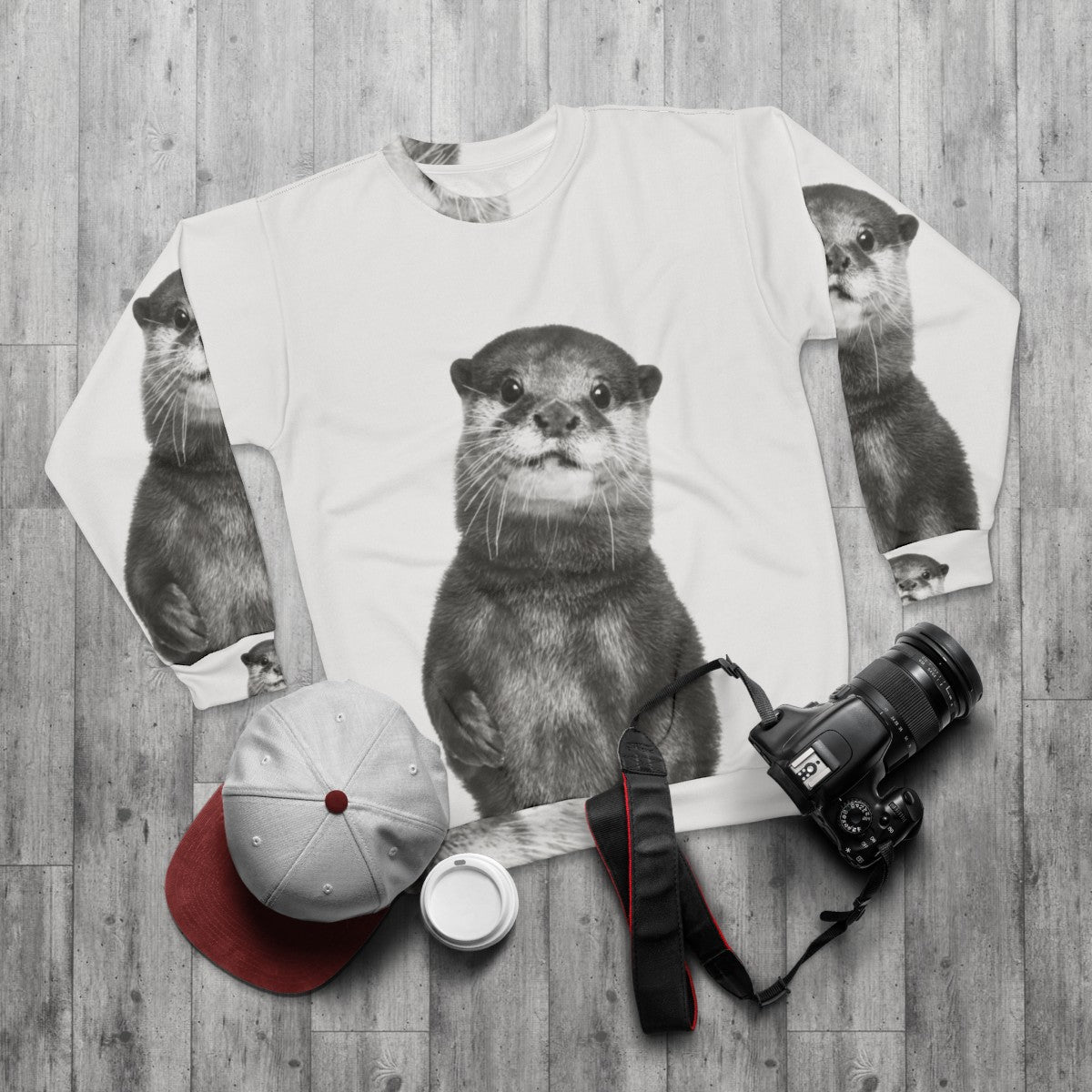 Otter sweatshirt with a cute animal portrait design - flat lay