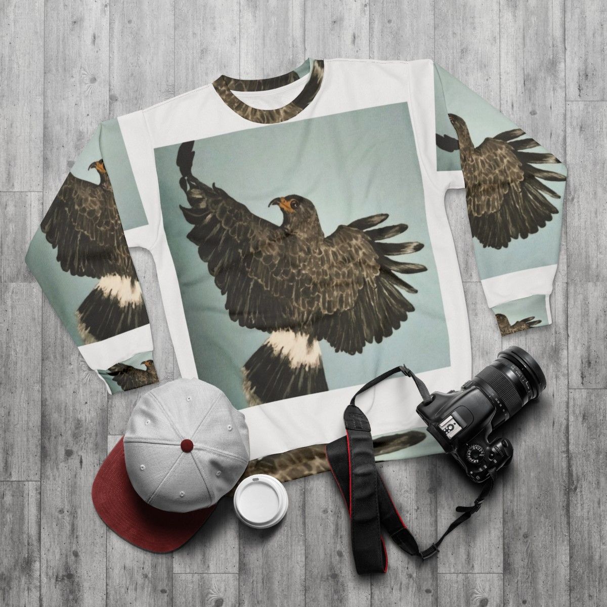 In Flight Sweatshirt featuring a soaring raptor - flat lay