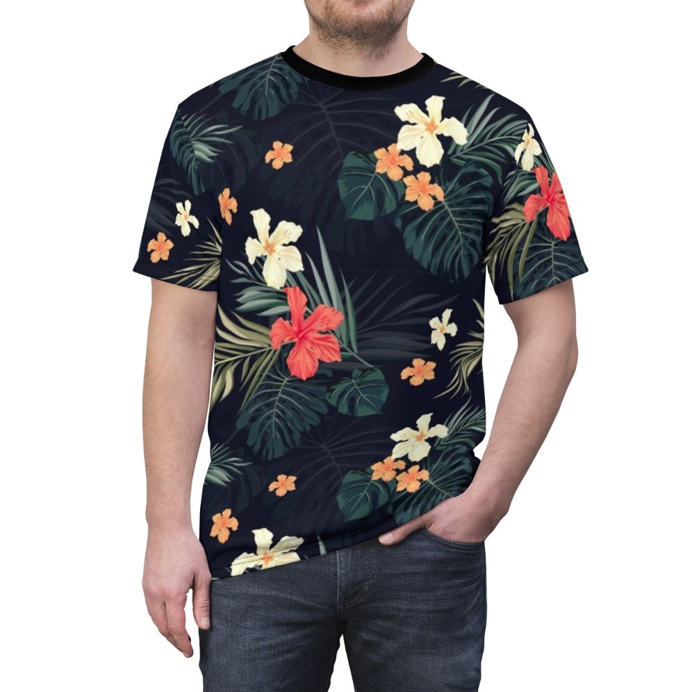 Model wearing a dark t-shirt featuring a tropical floral pattern design. - men front