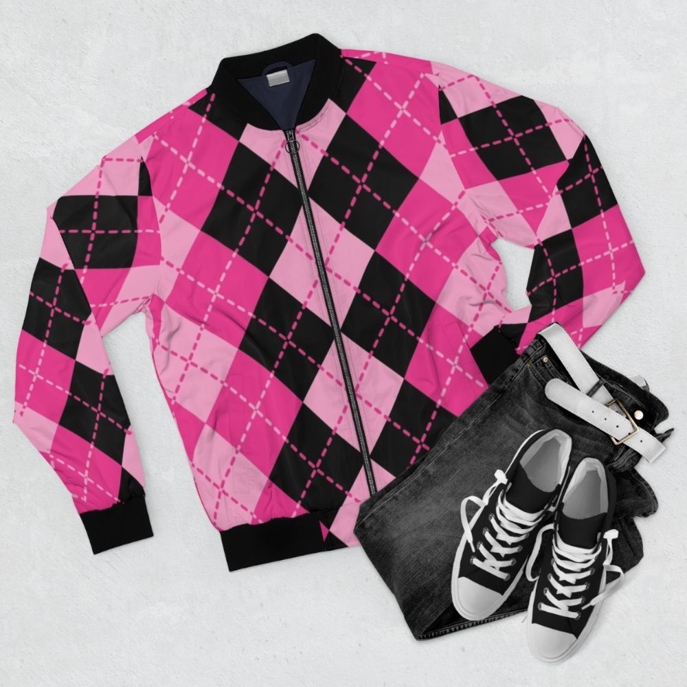 A pink bomber jacket featuring an argyle pattern design in a classic, retro-inspired style. - Flat lay