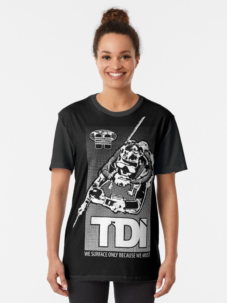 Technical Diving International (TDI) graphic t-shirt for tech divers featuring the "We Surface Only Because We Must" slogan - Women