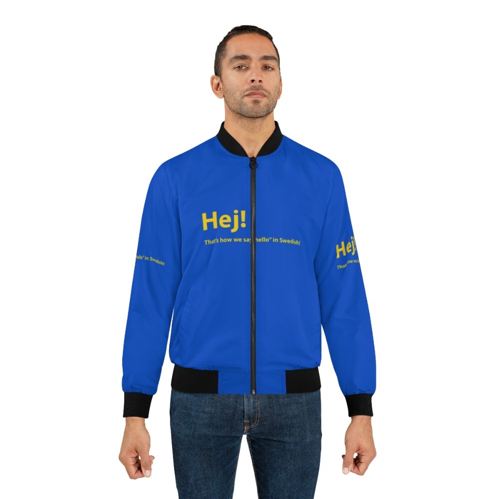 Swedish-inspired bomber jacket in yellow and blue with text and graphics. - Lifestyle