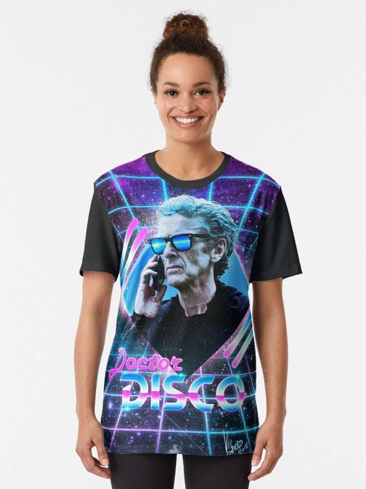 Retro "Doctor DISCO" graphic t-shirt featuring the image of the Twelfth Doctor, Peter Capaldi, in a vibrant, 80s-inspired neon style. - Women