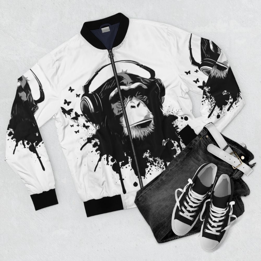 Monkey pattern bomber jacket with splash design and music-inspired elements - Flat lay