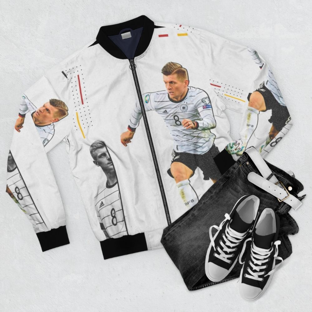 Toni Kroos Bomber Jacket - High-quality sports apparel featuring the soccer star's name and design - Flat lay