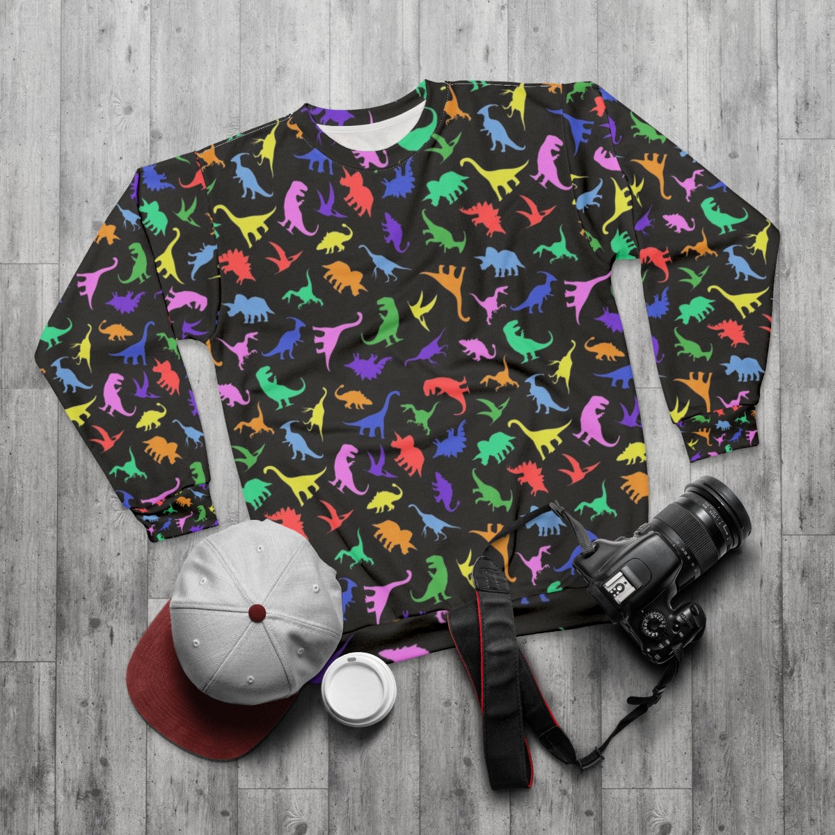 Black sweatshirt with a fun dinosaur pattern design - flat lay