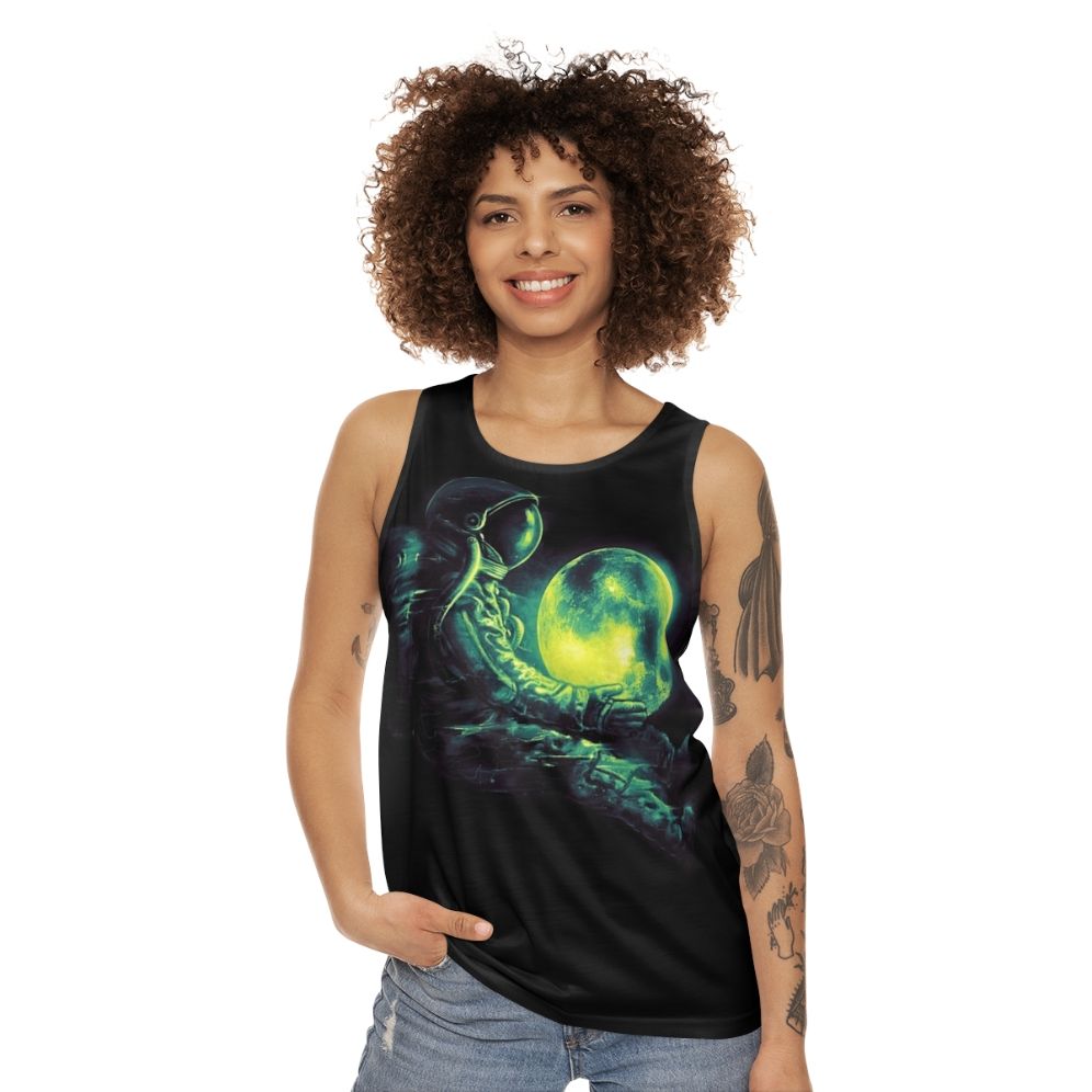 Unisex tank top with a cosmic, galactic design featuring a moon and astronaut - women