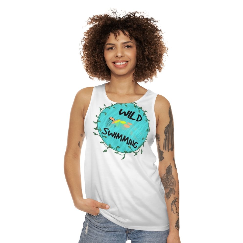 Model wearing the Wild Swimming Unisex Tank Top in a natural outdoor setting - women