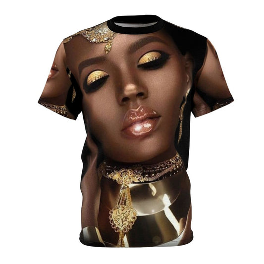 A vibrant and artistic t-shirt design featuring the face of an African queen or goddess with abstract patterns, jewelry, and cultural elements.