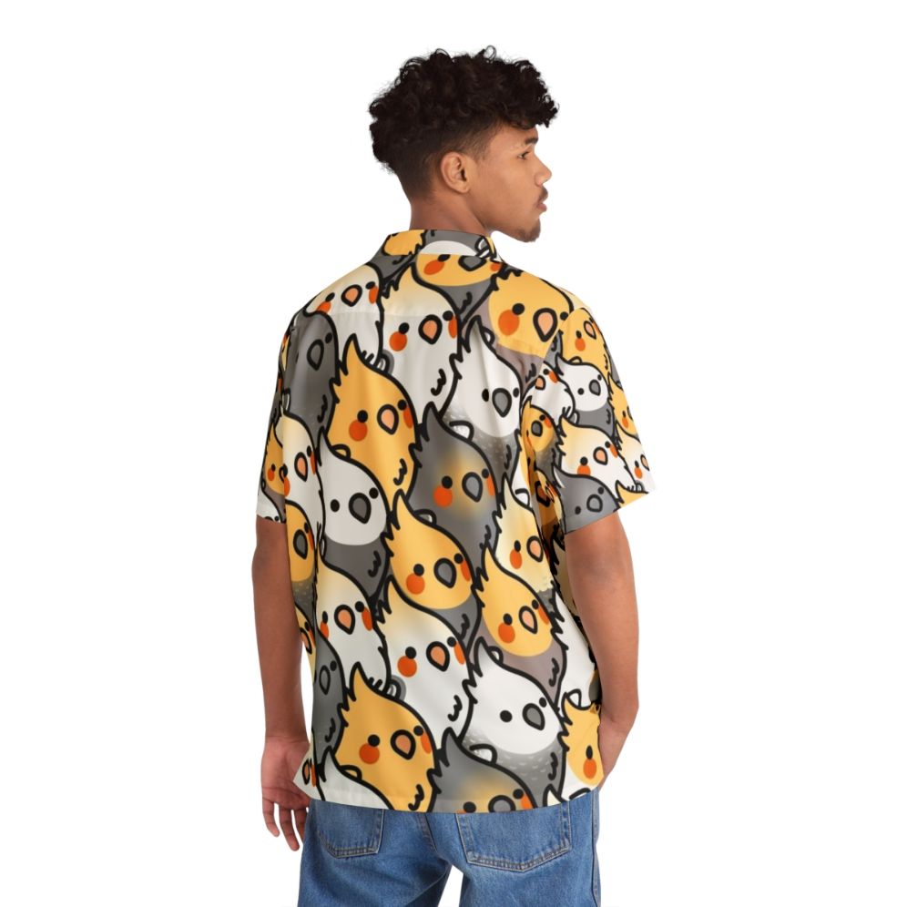 Chubby cockatiel wearing a vibrant Hawaiian shirt with a tropical bird pattern - People Back