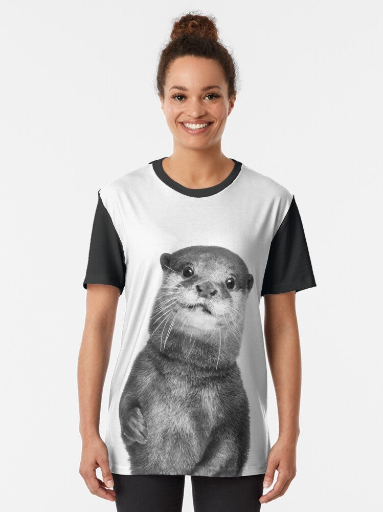 Graphic tee with a cute black and white otter portrait in a nature setting - Women