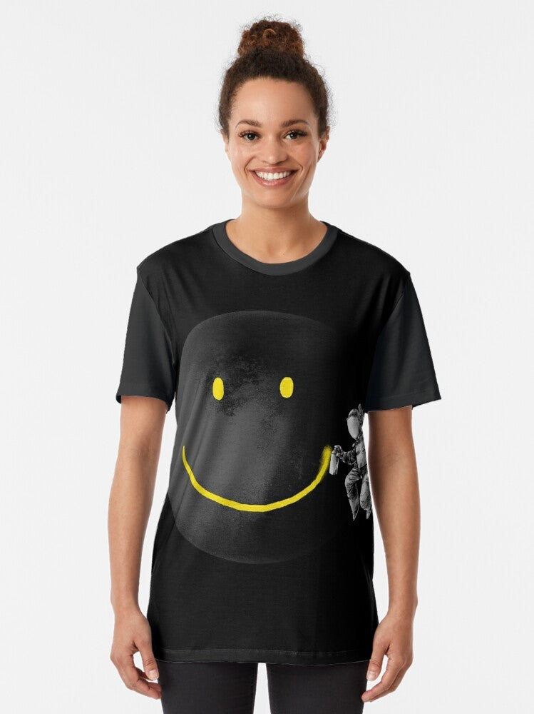 Surrealist t-shirt design featuring a smiling abstract face with an astronaut and the moon in a black and white sci-fi style - Women