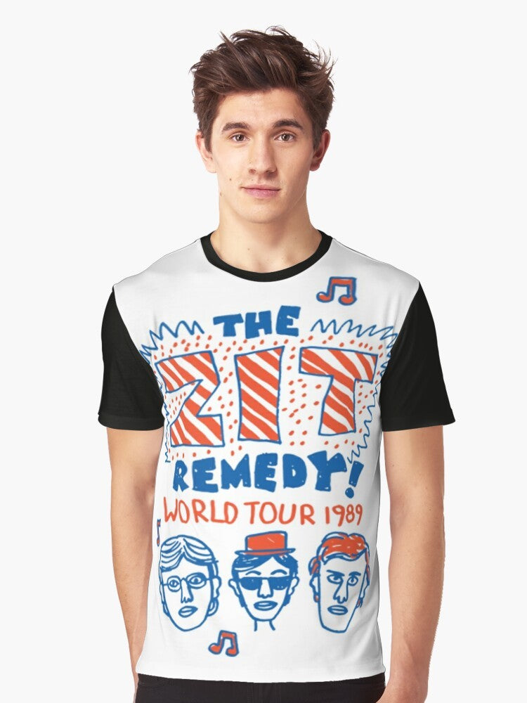 "Degrassi: The Zit Remedy Graphic T-Shirt featuring the iconic Zit Remedy band logo from the classic 90s TV series Degrassi Junior High." - Men