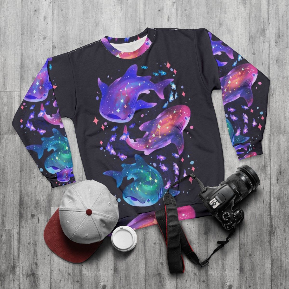 Cosmic whale shark graphic printed on a purple sweatshirt - flat lay