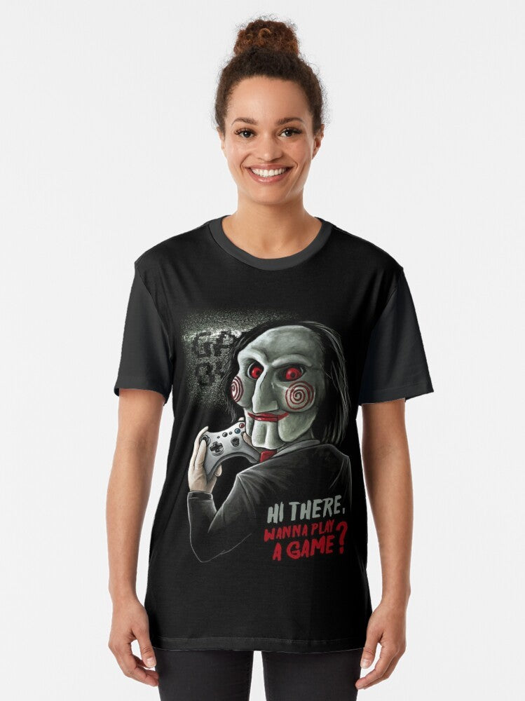 "Wanna Play a Game?" Saw-inspired graphic t-shirt featuring Jigsaw from the classic horror movie franchise - Women