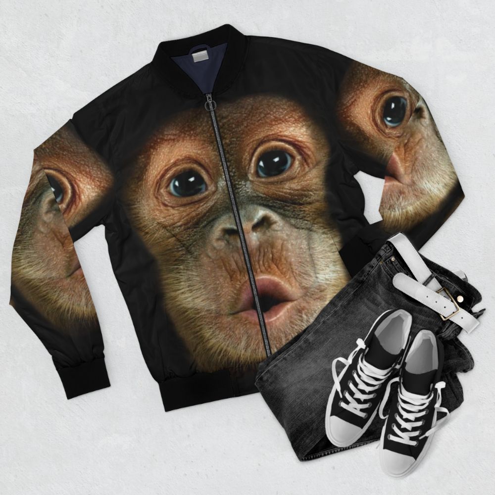 A bomber jacket with a funny chimpanzee face design - Flat lay