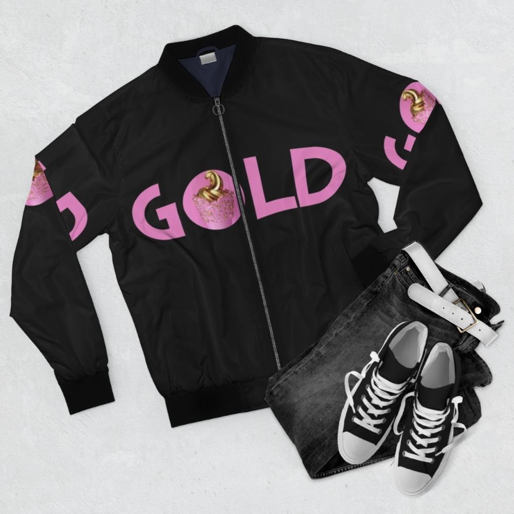 Trendy gold and pink bomber jacket with galaxy and unicorn design - Flat lay