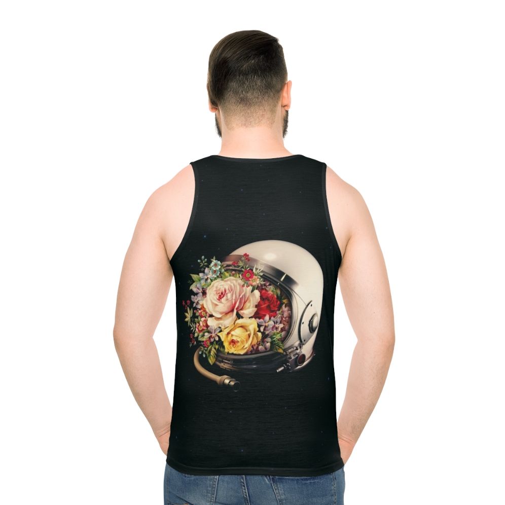 An astronaut in a space suit surrounded by flowers and stars on a cosmic, surreal tank top - men back