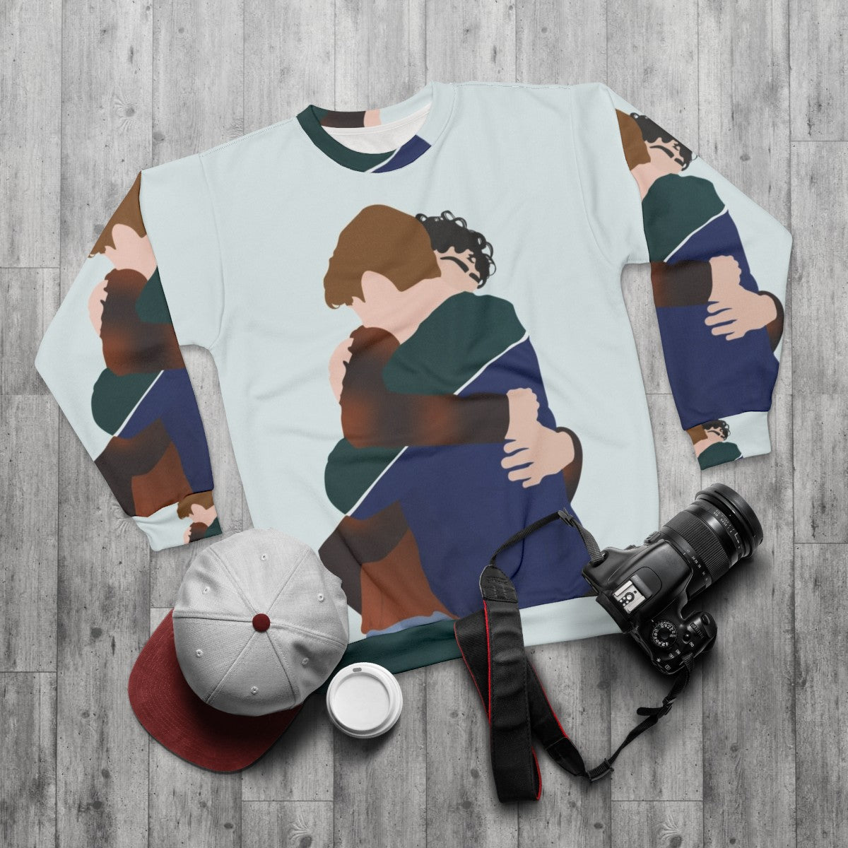 Heartstopper inspired sweatshirt featuring characters Nick Nelson and Charlie Spring hugging - flat lay