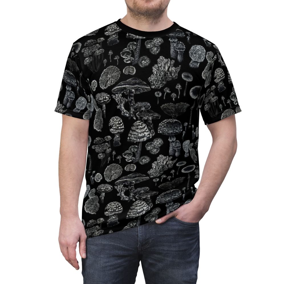 Monochrome t-shirt featuring a nature-inspired mycology design with mushrooms, fungi, and botanical elements in a sketch-like style. - men front