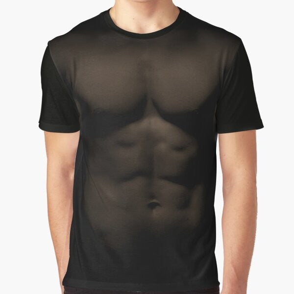 Muscular shirtless man with prominent pectorals and abdominals on a graphic t-shirt