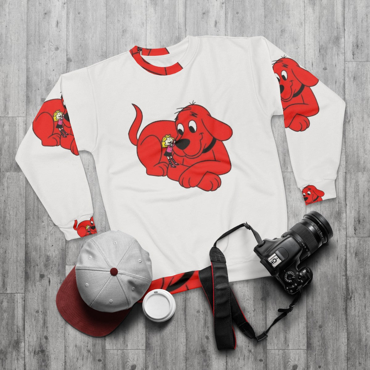 Clifford The Big Red Dog and Emily Elizabeth graphic on a red sweatshirt - flat lay