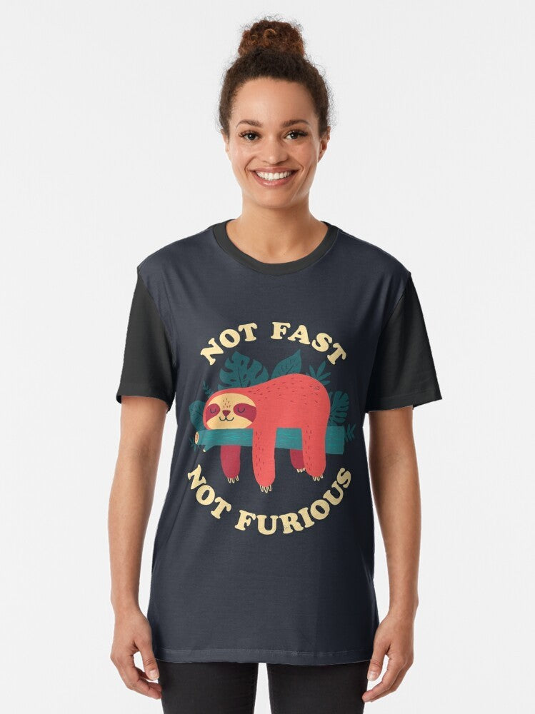 A cute and humorous graphic t-shirt featuring a sloth character sleeping peacefully with the text "Not Fast, Not Furious". - Women