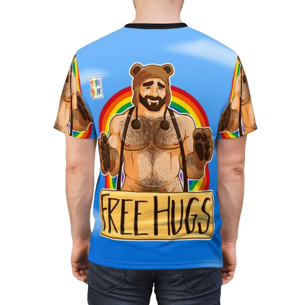 Vibrant graphic t-shirt featuring the text "Adam Likes Hugs" in a rainbow design for gay pride. - men back