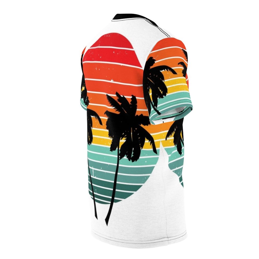 Person wearing a black t-shirt with a vivid tropical palm tree and sunrise silhouette design - men right