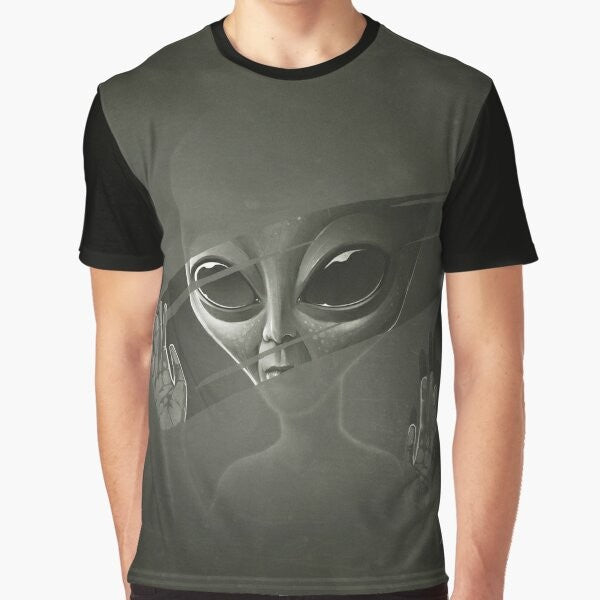 Alien graphic design on a black t-shirt, featuring a mysterious extraterrestrial creature in the cosmos.