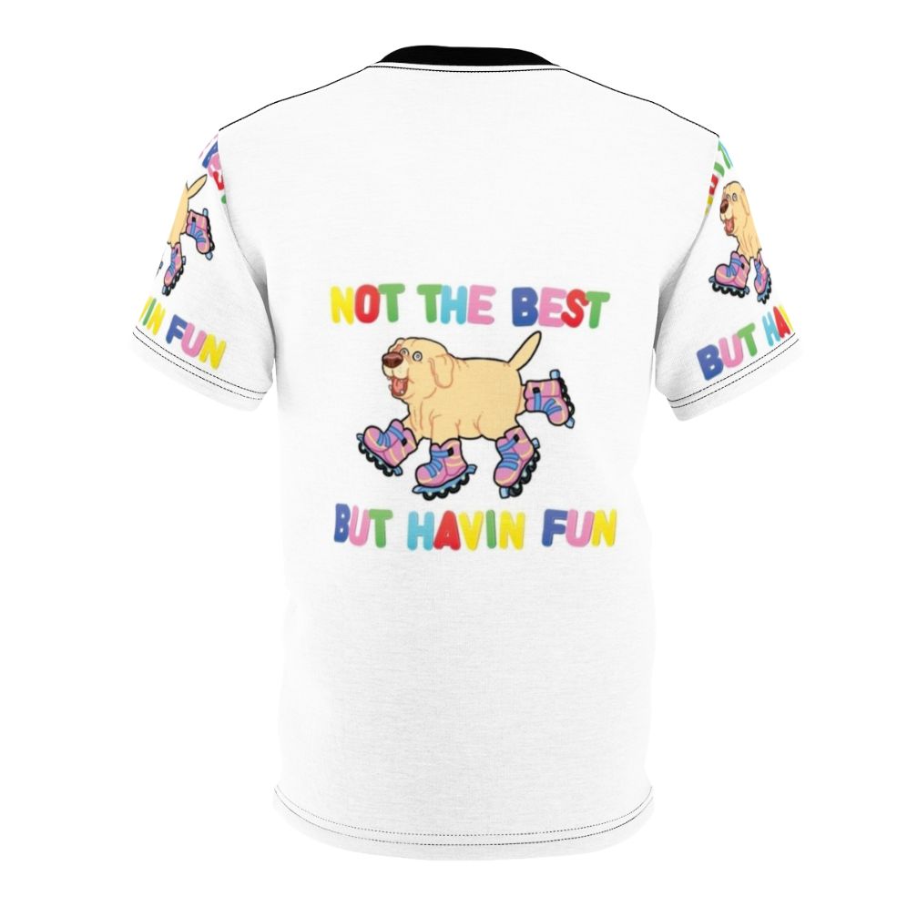 An AOP (all-over print) t-shirt featuring a playful dog on rollerskates or rollerblades, with the text "Not the best, but having fun". - Back