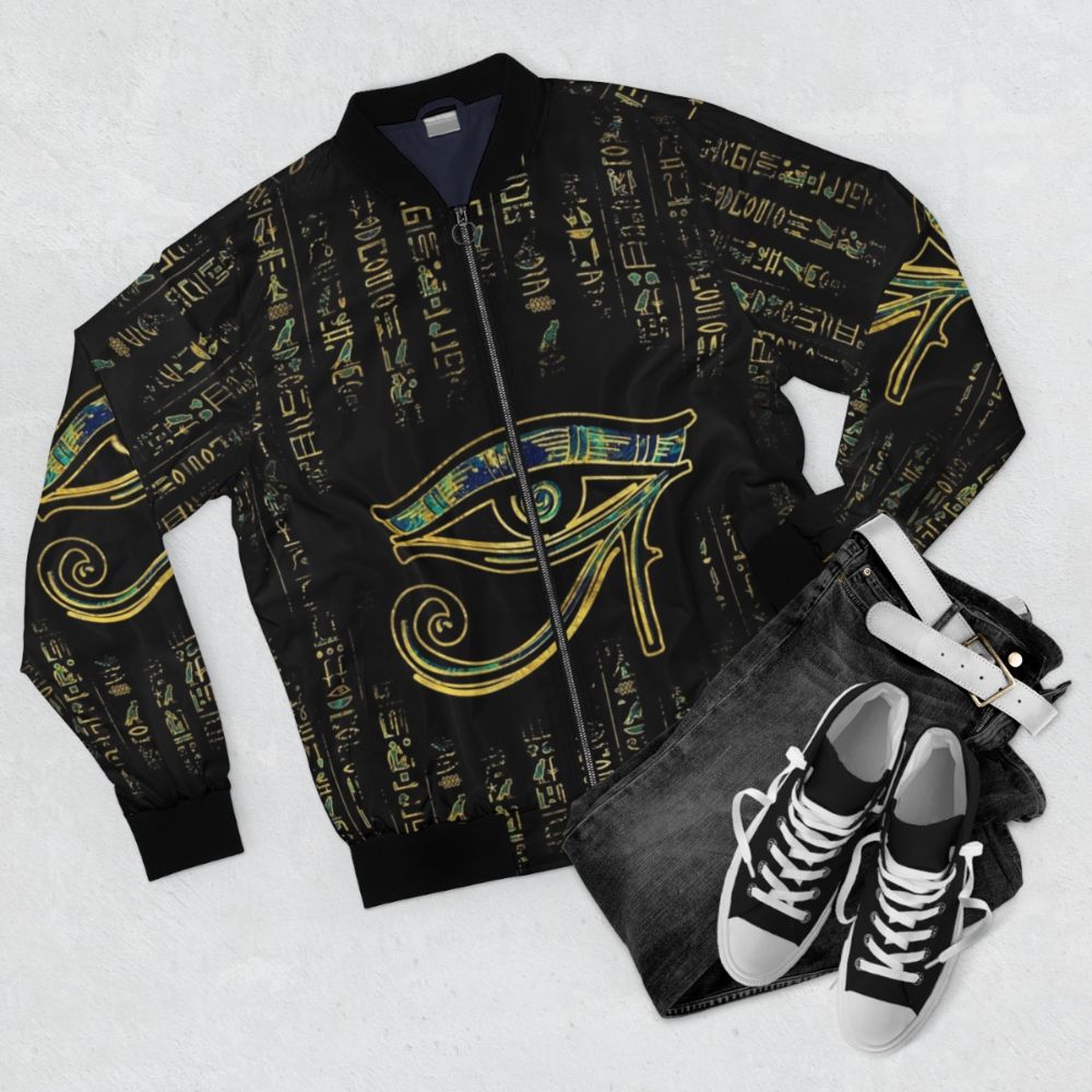 Egyptian Eye of Horus hieroglyphics gold and marble bomber jacket - Flat lay