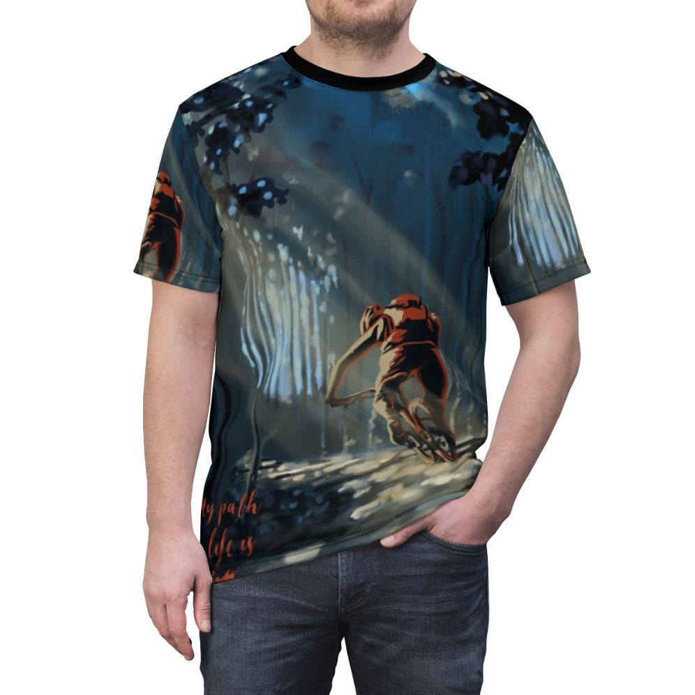 A stylized t-shirt design featuring a mountain biker riding through a forested landscape - men front