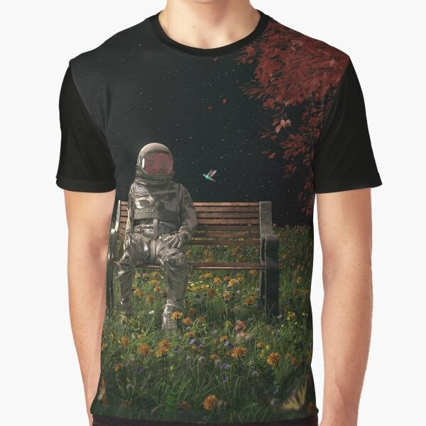 Surreal graphic t-shirt featuring an astronaut in a cosmic, nature-inspired landscape