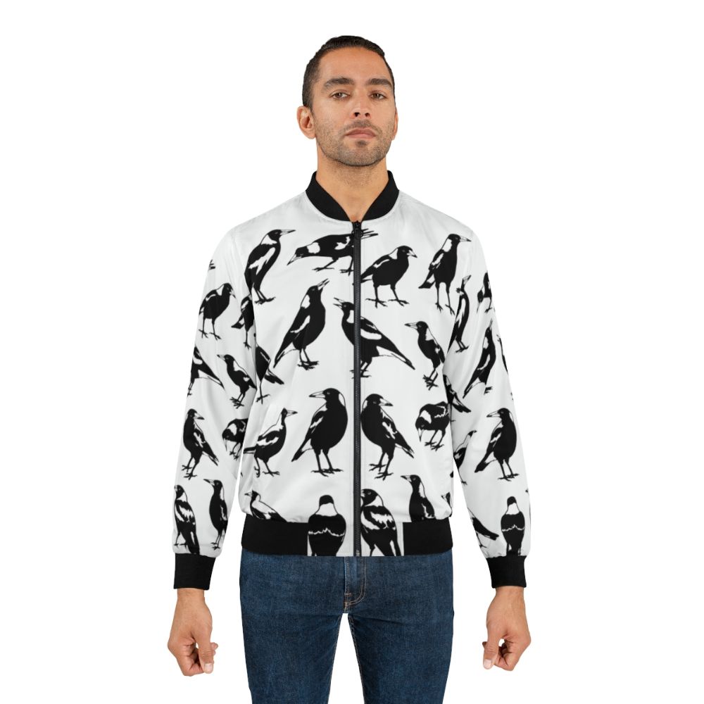 A stylish bomber jacket featuring the iconic Australian magpie bird in its natural habitat. - Lifestyle