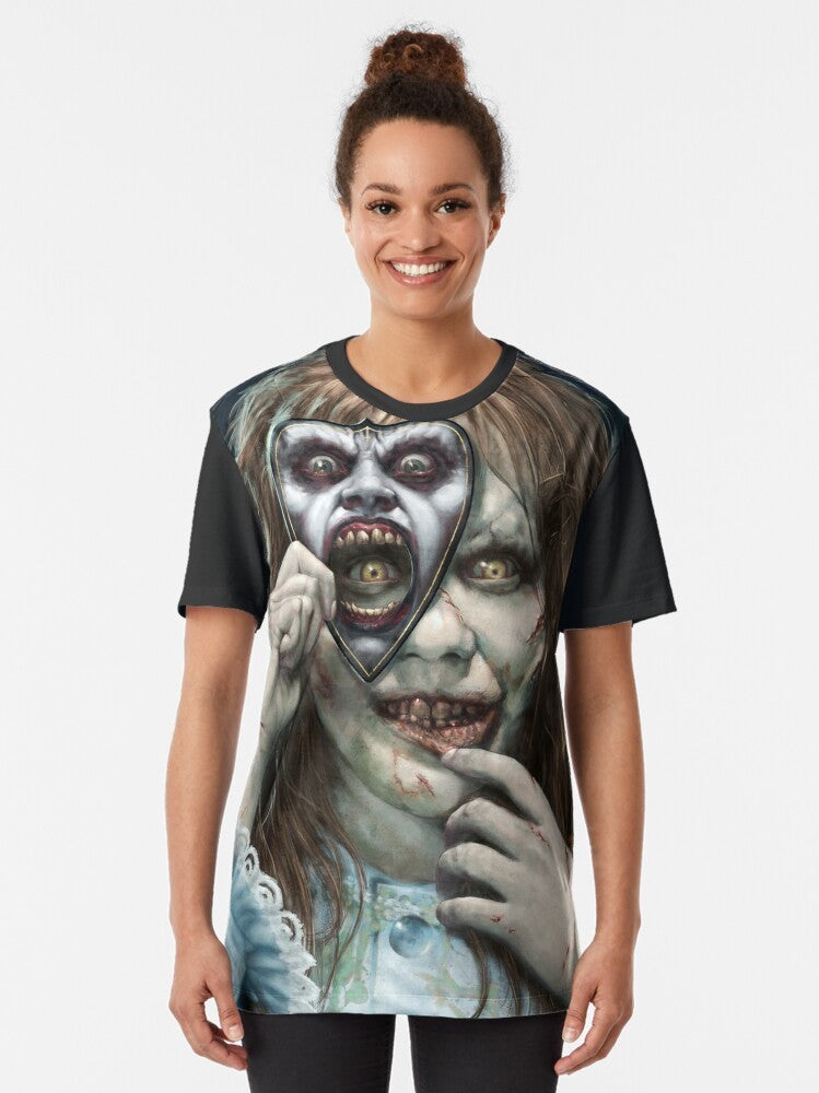 Exorcist Regan's Game Graphic T-Shirt featuring the possessed character from the horror movie - Women