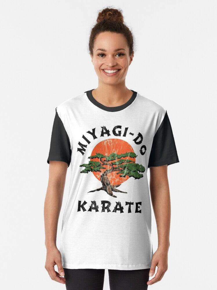 Vintage-style "Miyagi Do Karate" graphic t-shirt with distressed design, featuring karate kid and martial arts elements. - Women