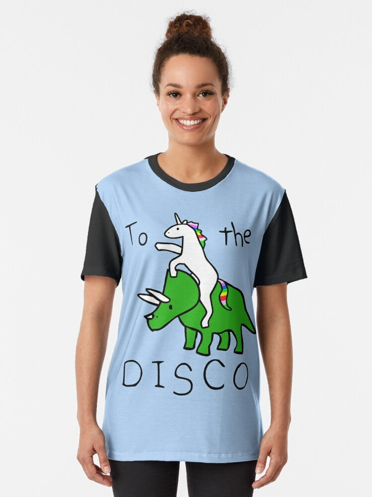 A graphic t-shirt design featuring a unicorn riding a triceratops in a disco setting. - Women