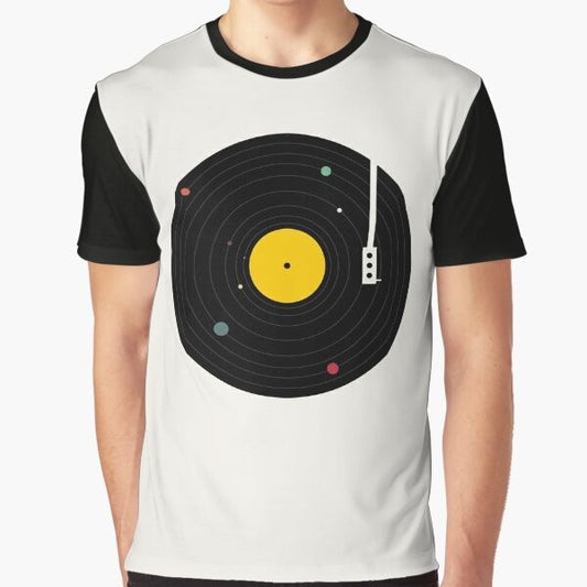 Music graphic t-shirt featuring a minimalist design of planets, galaxy, and a record player in a cosmic space theme.