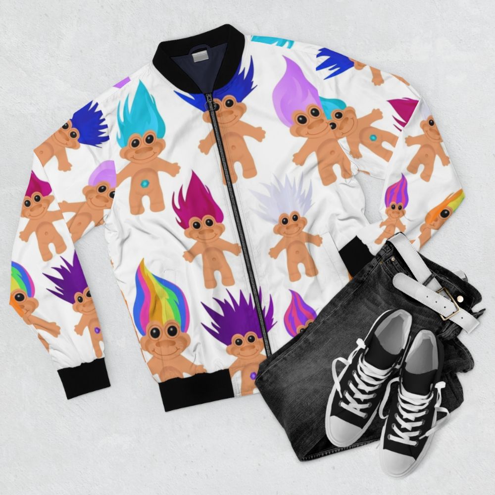 Colorful 90s-inspired bomber jacket featuring a troll doll design - Flat lay